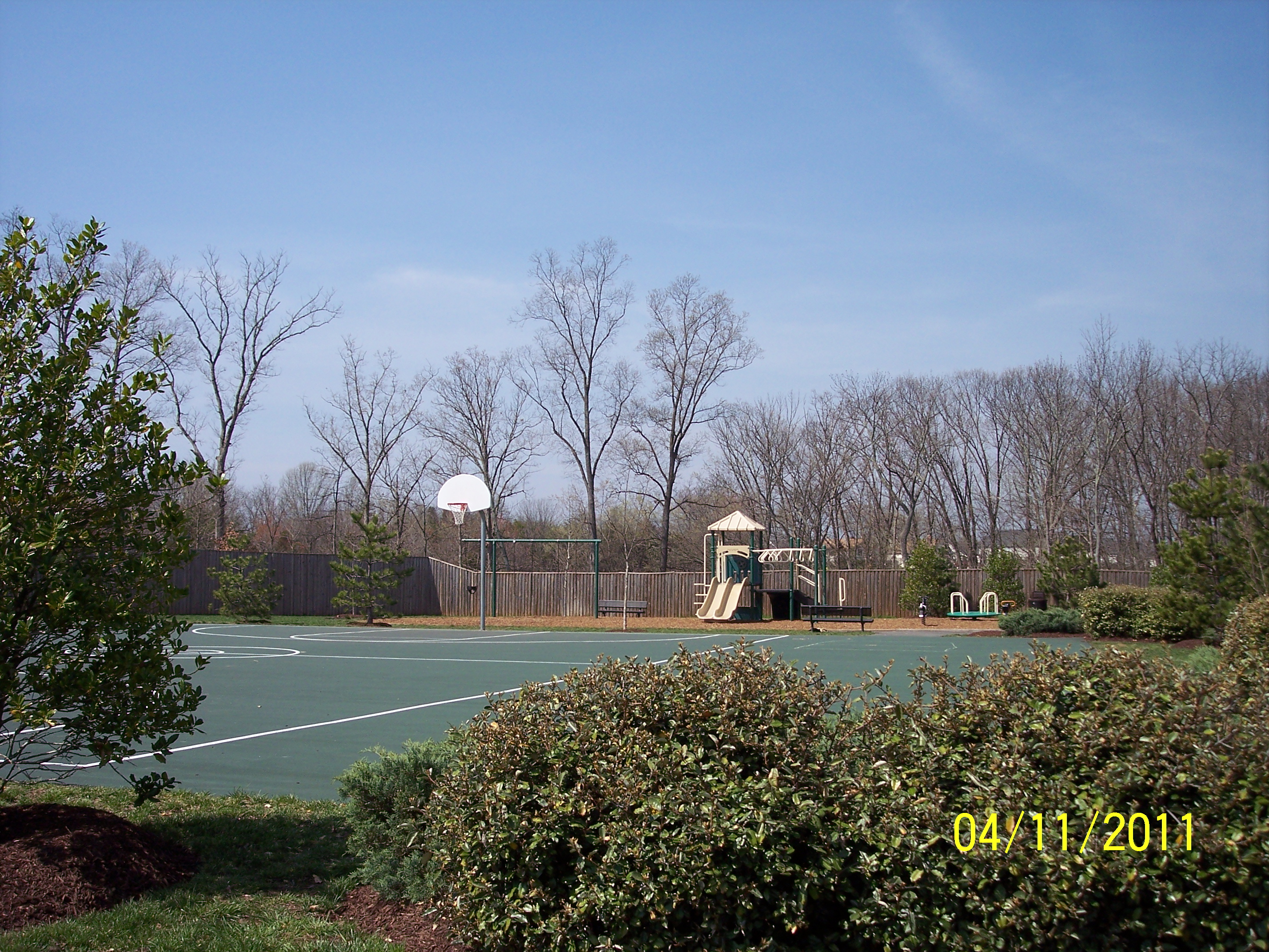 Basketball court and tot lot.  One of five tot lots.  We also have two tennis courts! thumbnail